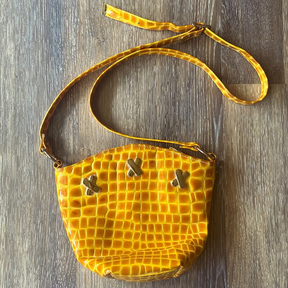 Talk of the Walk yellow shoulder bag with metal design and adjustable strap